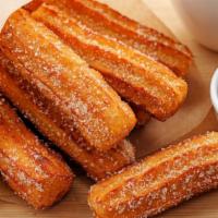 Churros (6 Pc) · Deep-fried fritters tossed in cinnamon sugar.