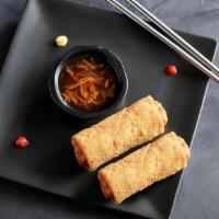Chicken Egg Rolls · Savory chicken egg rolls served with sweet chili sauce and hot mustard.
