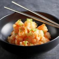 Boom Boom Shrimp · Fried shrimp bites, tossed in sriracha orange sauce and topped with green onions and sesame ...