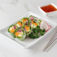Tuna Spring Wrap · Tuna, avocado, carrot and cucumber wrapped in green leaf lettuce.