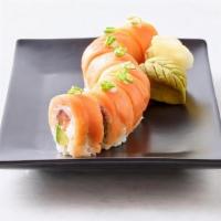 Salmon Lover Roll · Spicy salmon, avocado, cream cheese and nori wrapped in sushi rice. Topped with salmon, scal...
