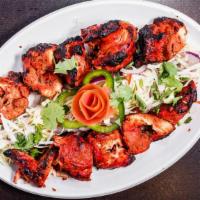 Chicken Tikka Kabob · Succulent white meat chunks marinated with our own special spices.