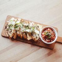 Bettah Bruschetta · Cheesy garlic bread, drizzled with balsamic and topped with fresh basil. Served with diced f...