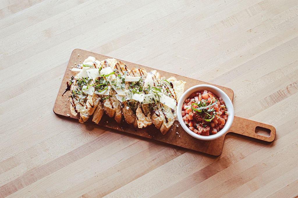 Bettah Bruschetta · Cheesy garlic bread, drizzled with balsamic and topped with fresh basil. Served with diced fresh Roma tomatoes.