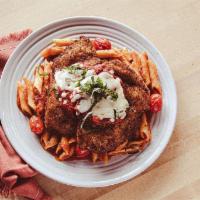 Chicken Parmigiana · Wow, chicka, wow, wow! Crunchy Italian breaded chicken topped with blistered tomatoes, fresh...