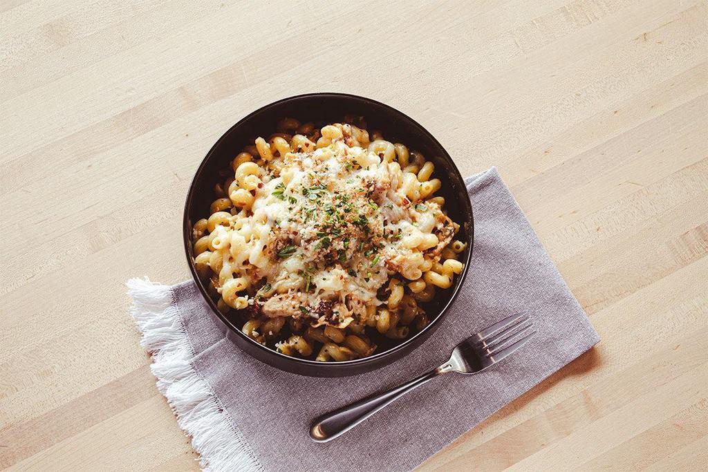 Chicken Bacon Macaroni · Bacon makes everything better, and when you add bacon AND cheese sauce it’s pasta perfecto! Cavatappi, Applewood chicken, golden cheese sauce, peppered bacon, basil breadcrumbs.