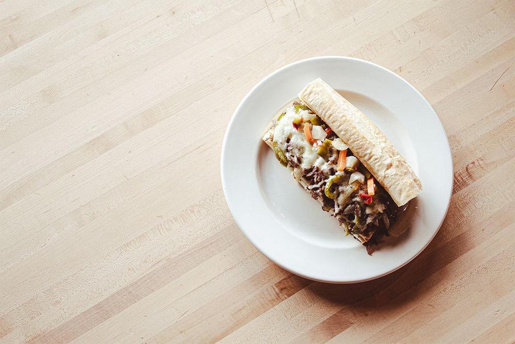 Italian Chicago Cheesesteak · There’s regular cheesesteak…and then there’s Chicago. cheesesteak, our version takes the spice up a notch with thinly sliced sirloin steak, sautéed peppers & onions, pepper jack cheese and giardiniera.