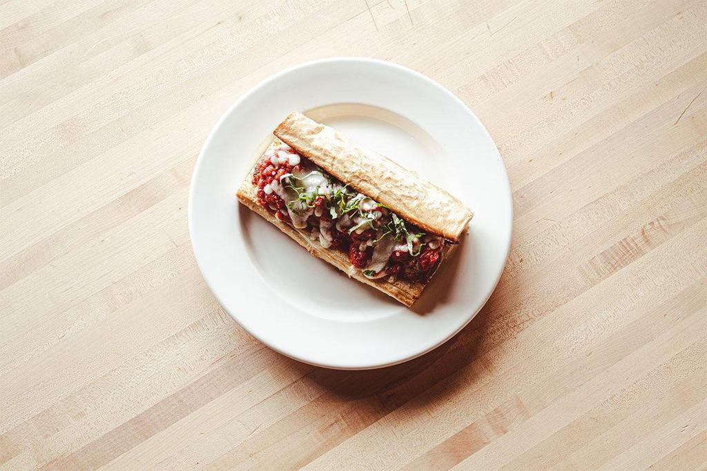 Homestyle Meatball Sandwich · Don’t wear your white shirt! Toasted French roll with our homemade meatballs, topped with marinara, mozzarella, and fresh basil.