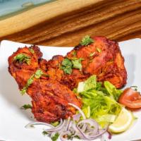 Grilled Chicken · Marinated chicken is grilled to perfection in a Tandoor, a cylindrical clay oven.