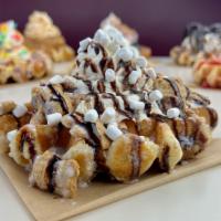 S'Mores Waffle · Our delicious Belgian Pearl Sugar waffle, dusted with powdered sugar, cinnamon streusel crun...