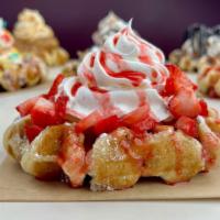 Strawberry Lovers Waffle · Our delicious Belgian Pearl Sugar waffle, dusted with powdered sugar, topped with fresh cut ...