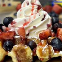 Very Berry Waffle · Our delicious Belgian Pearl Sugar waffle, dusted with powdered sugar, topped with fresh cut ...