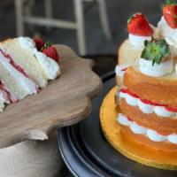 Strawberry Short Cake · Vanilla cake filled with whipped cream and fresh strawberry slices topped with French butter...