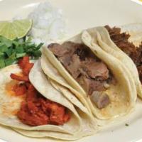 Taco Platter Special · 3 tacos, rice, beans, cilantro, onion, lemon, potato, and grilled jalapeño.