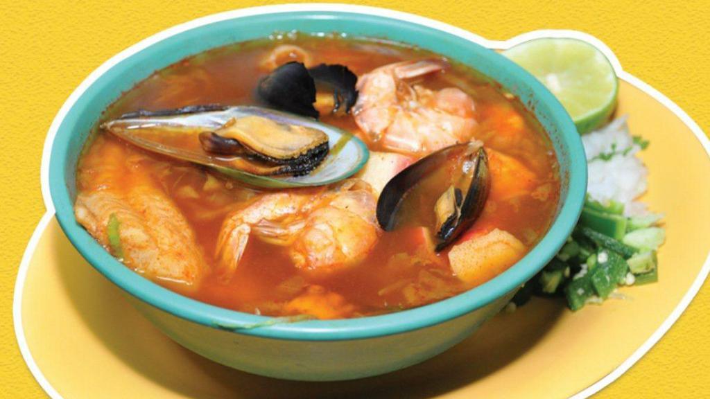 Caldo De Mariscos · Fish fillet, shrimp, octopus, squid, clams, black clam, potatoes, and carrots. Bread or flour tortillas (3) or corn tortillas (5).
