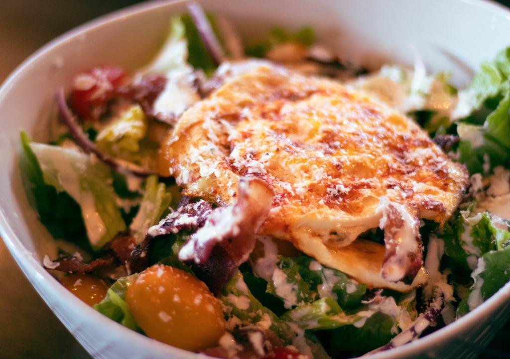 Cobb Salad · Hearts of Romaine, Cherry Tomatoes, Bacon, Fried Egg, Red Onions, 
Gorgonzola with a House Ranch Dressing