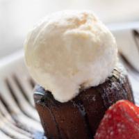 Lava Cake · Warm and Gooey in the Center,
Served with Chocolate Sauce and Fresh Berries