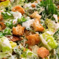 Classic Caesar Salad · Made with fresh Romaine Lettuce, Croutons, Parmesan Cheese and Caesar Dressing.