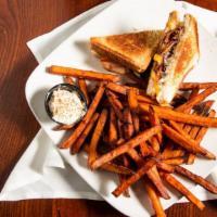 Grown Up Grilled Cheese · Blend of three cheeses with choice of brisket, pulled pork or applewood smoked bacon.