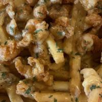Crawfish Cheese Fries / Papas Fritas Con  Queso De Cangrejo · Fries smothered with our Cajun cheese sauce top off with batter-fried crawfish tails.