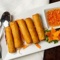 Thai Crispy Spring Rolls · 5 pieces. Pork, carrots, cabbage, and noodle wrapped in Thai spring roll wrap.
