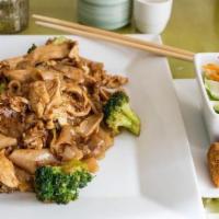 Pad See Ew · Stir-fried flat rice noodles in sweet black sauce with egg, and broccoli.