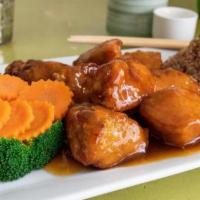 Orange Chicken · Oriental style orange sauce with breaded boneless chicken and broccoli. All dishes served wi...