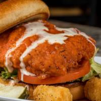 Buffalo Chicken Sandwich · Hand-breaded chicken breast deep-fried and dipped in our legendary hot sauce. Served on a to...