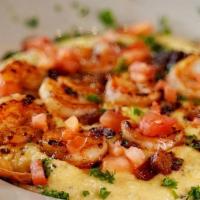 Shrimp And Grits · Our signature cheese grits topped with sauteed shrimp, tomatoes, garlic, and bacon