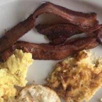 Two Eggs Breakfast Deluxe · Two eggs cooked to order with your choice of breakfast meat, choice of grits or hashbrown ca...