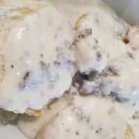 Biscuits And Gravy · Two split buttermilk biscuits smothered in sausage gravy.