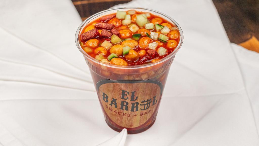Cacahuates Especiales · Japanese peanuts, clamato, cucumber, forritos, and spices.