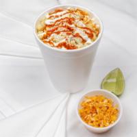 Elote En Vaso · Corn in a cup served with sour cream, cotija cheese, spices, valentina and lime