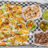 Nachos · Tostadas with cheese, cheddar , beans, lettuce sour cream, chipotle sauce. Served with guaca...