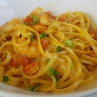 Parmesan Linguine Shrimp Pasta · With sautéed shrimp, caramelized onions and bell peppers in a creamy parmesan sauce.