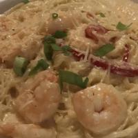 Parmesan Shrimp · Linguini tossed in sautéed shrimp caramelized onions and bell peppers in a creamy parmesan s...