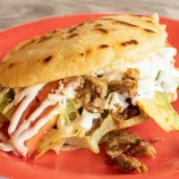 Gordita · Thick corn tortillas stuffed with choice of meat, beans, lettuce, tomato, cream, cheese and ...
