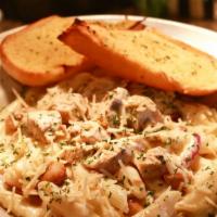 Chicken Alfredo Penne · Penne pasta, grilled chicken, roasted-smoked garlic and grilled onions in Alfredo sauce. Glu...