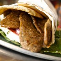 Greek Gyro · Strips of beef, tzatziki sauce, tomatoes and onions in a pita wrap. Add feta cheese for an a...