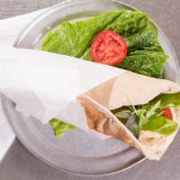 Homus Wrap · Pita wrap with homus, tomatoes, field greens and pickles. Served on a whole wheat pita. Vegan.