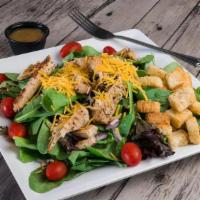 Grilled Chicken Salad · Garden-fresh assorted greens, tomatoes, onions, shredded cheese, croutons, chargrilled chick...
