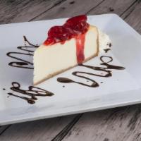 Strawberry Ny Cheesecake · Soft, fresh cream cheese on a buttery graham cracker crust topped with whipped cream and str...