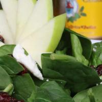 Baby Spinach Salad · Gluten-Free. With sliced granny smith apples, feta cheese crumbles, candied pecans, dried cr...