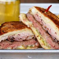 Cuban Pressed Burger (1/3 Lb) · 1/3 pound patty, applewood smoked ham, gruyere cheese, pickles, and horseradish mustard, pre...