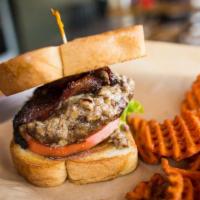 Pecan Street Blues Burger (1/3 Lb) · 1/3 pound patty topped with wright peppered bacon and blue cheese pecan sauce, with mixed gr...