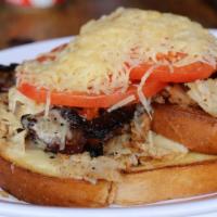 Louisville Slugger Sandwich · Thinly sliced roasted turkey breast, peppered bacon, gruyere sauce, tomatoes, and parmesan c...