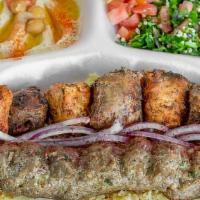Mixed Grill Platter · 3 skewers. Chicken, lamb, and kofta. Comes with tomato, lettuce, onion, white, and hot sauce.