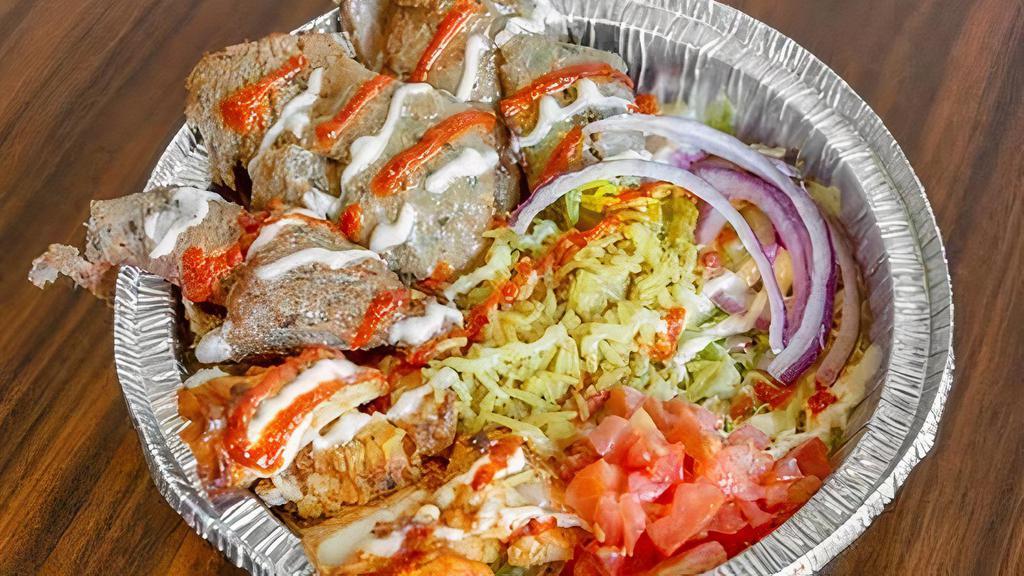 Gyro Platter (Beef & Lamb) · Comes with tomato, lettuce, onion, white, and hot sauce.