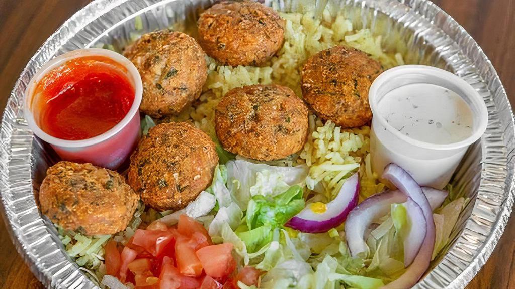 Falafel Platter (Vegetarian) · Spices and tahini sauce. Comes with tomato, lettuce, onion, white, and hot sauce.