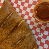All Meat Calzone · Made with Italian sausage, Canadian bacon, pepperoni and served with marinara sauce.